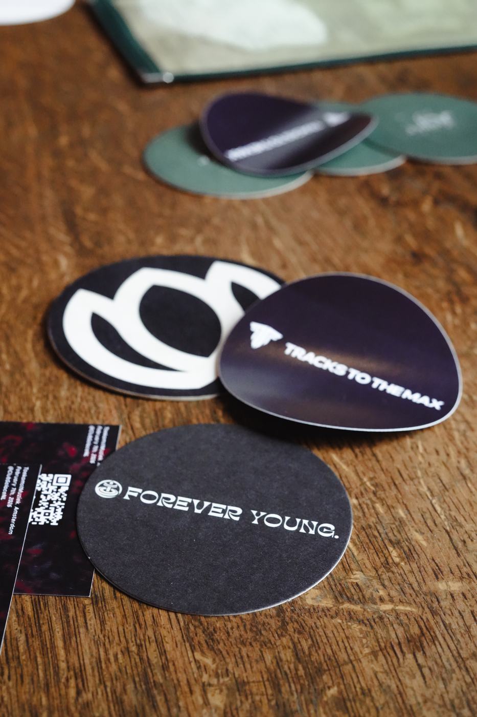 Relavel, Tracks To The Max and Forever Young coasters on a table